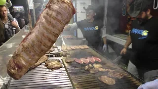 Huge Grill of Beef and Sausages from Argentina. Italy Street Food Festival