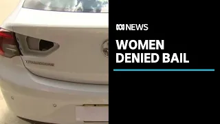 Two women denied bail after woman allegedly stabbed and locked in boot of her own car | ABC News