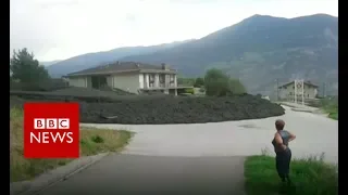 Mudslide erupts in Swiss village - BBC News