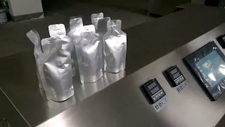 Stand pouch filling and sealing machine