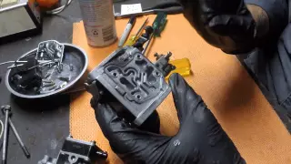 Cleaning a carburettor from an outboard motor