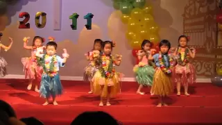 Sarah hula dances at her pre-school's graduation ceremony