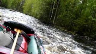 Canoeing rapid in Kutujoki river, near Oulu, Finland