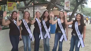 Weather Chief Bill Taylor talks with Miss Helotes and her court at the Cornyval Festival