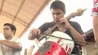 Children's Orchestra Play Instruments Made from Trash