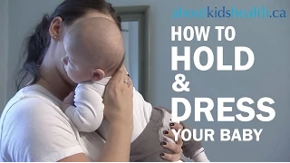 How to hold and dress your newborn baby