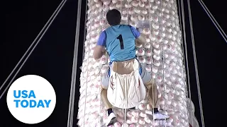 Watch: Competitors race up tower of buns in unusual challenge | USA TODAY