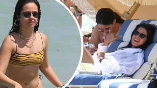 Camila Cabello sends temperatures soaring with her tiger-stripe bikini as she hits the beach