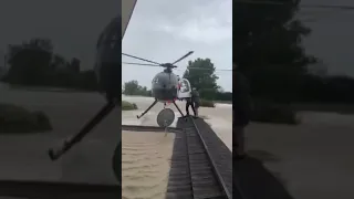 Cyclone Gabrielle: helicopter pilot balances on roof in 'daring' New Zealand rescue #shorts