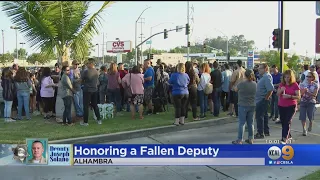 Somber Vigil Held For Slain Sheriff's Deputy Killed While Ordering Food