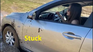 Girl With Silver Car Stuck in Mud