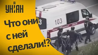 В Минске задержанную из автозака переносят в машину скорой помощи