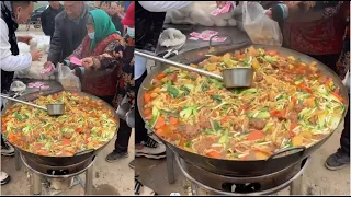 A Chinese man serves free dinner to the elderly in rural areas