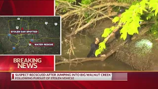 Car theft suspect rescued after jumping off bridge into creek