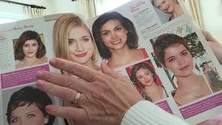 ASMR roleplay with page turning; flipping through hairstyle magazine with salon client.