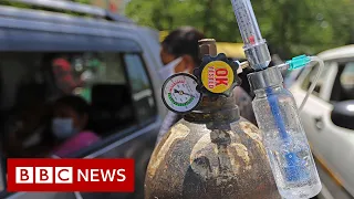 Indian temple offers drive-through oxygen amid Covid crisis - BBC News