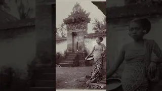 A girl outside of a temple in Bali, Indonesia, c. 1890s-1920s