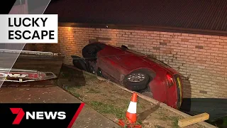 Driver's lucky escape after wedging car between home and wall at Modbury Heights | 7NEWS