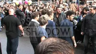 One Direction coming out of their hotel with fans in Paris