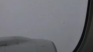 Time lapse plane in a storm