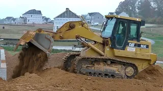 Caterpillar 963C Track Loader Backfilling a Foundation