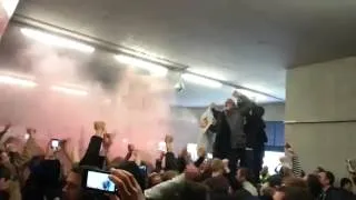 Manchester united fans celebrating winning the premier league title away at Arsenal 2013