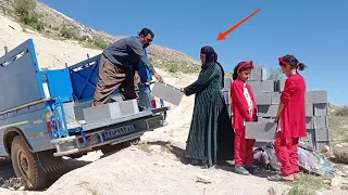 Grandmother and orphan girls journey for building blocks supported by operator and van driver