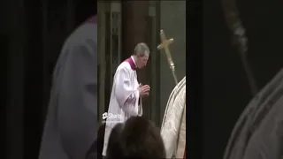 Mons Guido Marini saves Pope Benedict XVI's ferula from falling to the ground