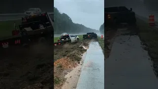 blacked out ram 2500 cummins pulls utility truck back on road #ram2500 #cummins #mudrunner