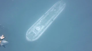 Atlantis submarine passing at carthaginian wreck