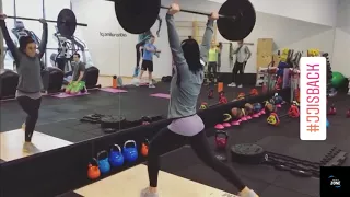 Joanna Jedrzejczyk lifting weight.