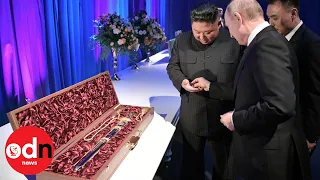 Kim Jong-un gives Vladimir Putin a SWORD at final summit dinner