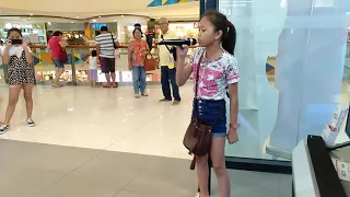 A kid singing "Listen by Beyoncé" at Robinson's Mall Tacloban City