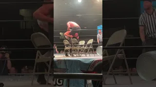 Mike Bennett piledriver thru chairs