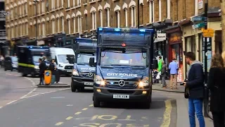 x4 City of London Police vans responding in convoy