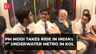 PM Modi takes Metro ride with students in India's 1st underwater tunnel in Kolkata