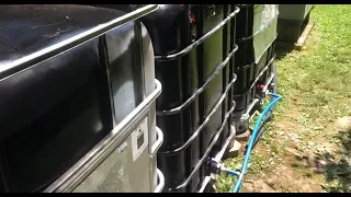 750 gallon off grid/on grid rain catchment and pumping system install by Off Grid Contracting