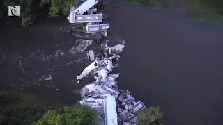 Dramatic drone footage shows train derailed in Iowa