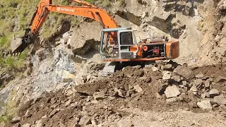 mashinery Working in the marbal  ston mountain view in Pakistan