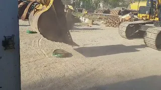 Crushing 55 gallon drum with excavator.