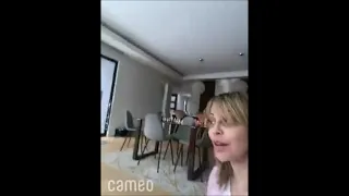 Tara strong singing candidly to her dog