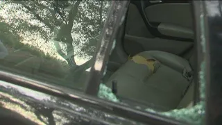 Video shows woman throw hatchet through car window | KVUE