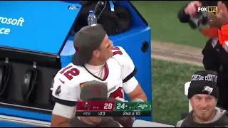 Tom Brady makes a catch from Zach Wilson