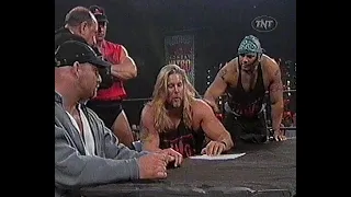 Goldberg & Kevin Nash sign a contract to fight on Starcade 1998.