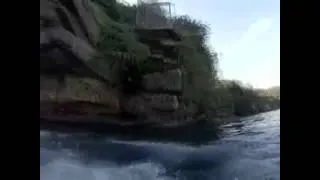 Man Jumps off Cliff, Lands Next to Great White