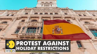 Hundreds of protesters march through central Barcelona against the new holiday restrictions | WION