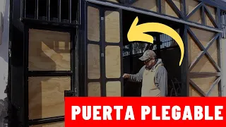 PUERTA PLEGABLE sobre riel de corredera