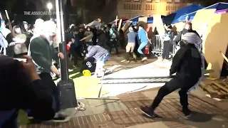 Violent clashes break out at UCLA after counter-protesters storm pro-Palestinian encampment