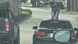 Man jumps on woman's car, breaks windshield in alleged fit of road rage