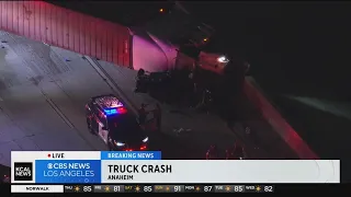 Semi truck overturns onto car on 91 Freeway in Anaheim